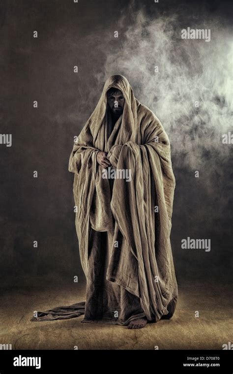 cloaked figure in smoke Stock Photo - Alamy