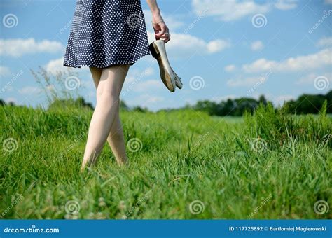 Woman Barefoot Walk in Grass Stock Photo - Image of holding, dress: 117725892