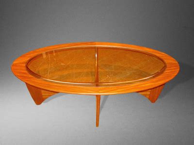 A 1960 / 70's teak oval Coffee Table with inset toughened glass - G ...