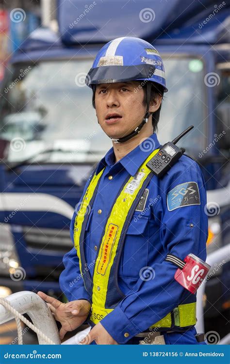 Japan, Tokyo, 04/12/2017. Road Worker in Uniform on a City Street Editorial Photo - Image of ...