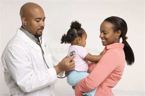 Mother Holding Baby For Pediatrician To Examine. Royalty Free Stock ...