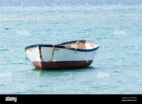 small boat floating in the middle of the sea, Canary Islands, Spain ...