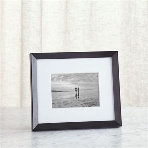 Give a treasured photo the presentation it deserves with this classic frame. The thick white mat ...