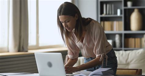 Focused happy young woman working remotely on computer. Stock Video ...