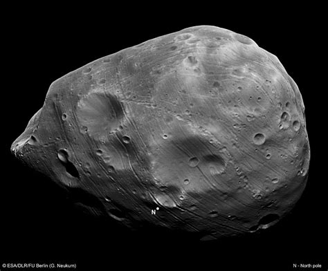 Mystery of Martian moon's weird craters is solved | Daily Mail Online