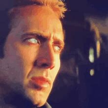 Nicolas Cage Trying Not To Laugh Gif