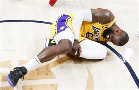 NBA playoffs: LeBron James struggles, tweaks injured foot as Lakers ...