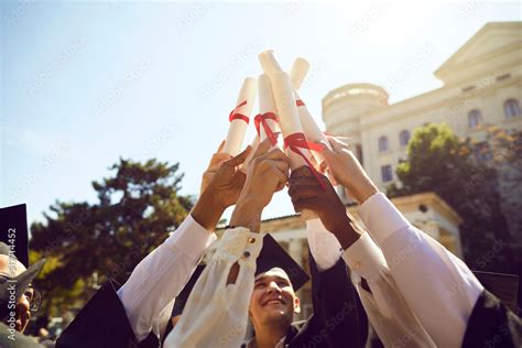 Happy university students celebrating their graduation. Diverse group ...