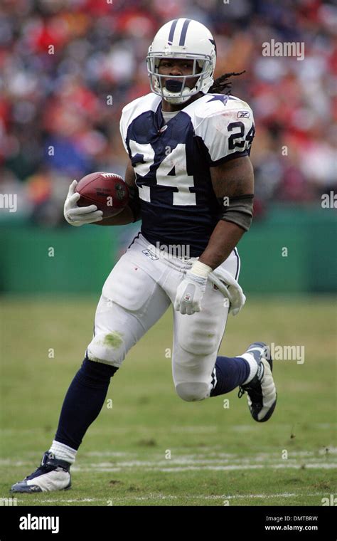 Dallas Cowboys running back Marion Barber (24) scrambles for yardage during the Cowboy's 26-20 ...