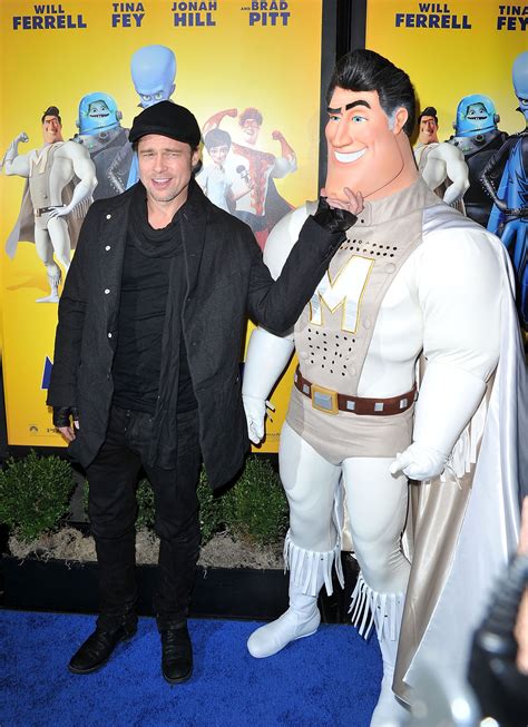 Brad Pitt poses with Metro Man, the character Pitt voiced, at the movie premiere of "Megamind ...