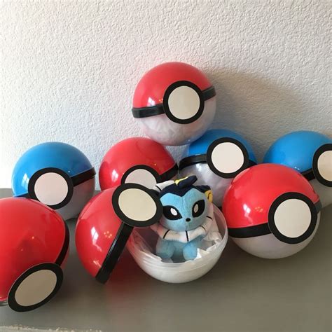 some pokemon balls and pokeballs on a table