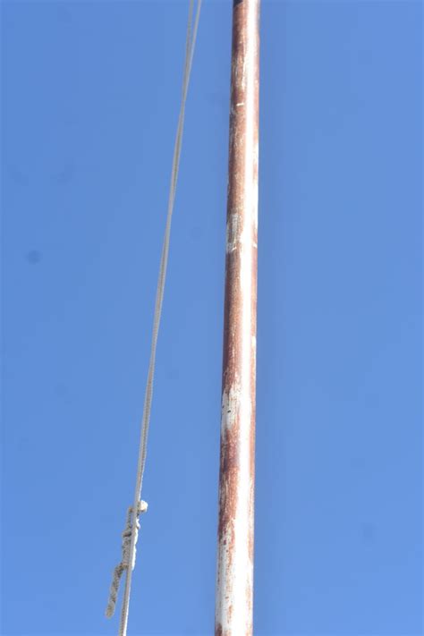 How To Safely Install a Flagpole That Will Last - ManMadeDIY