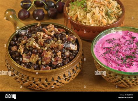 Typical Food Latvia. Grey peas with bacon and borscht Stock Photo - Alamy