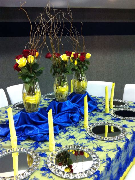 Designed arrangements to flow with color scheme of blue and yellow | Table decorations, Decor ...