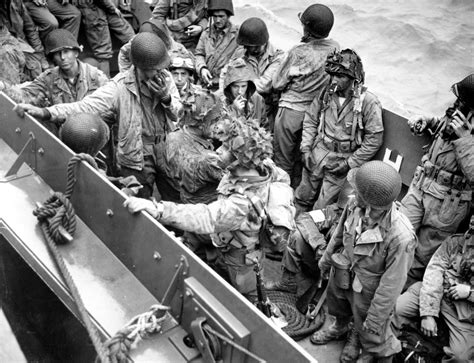 [Photo] Airborne glider pilots aboard an LCVP on their way from the Normandy beaches to a ...