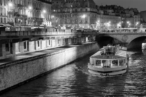 Premium Photo | Paris river bateau mouche night view in black and white