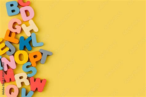 Colorful letters of the alphabet on yellow background. Primary school ...