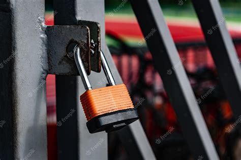 Premium Photo | Padlock on metal gate, security and protection.