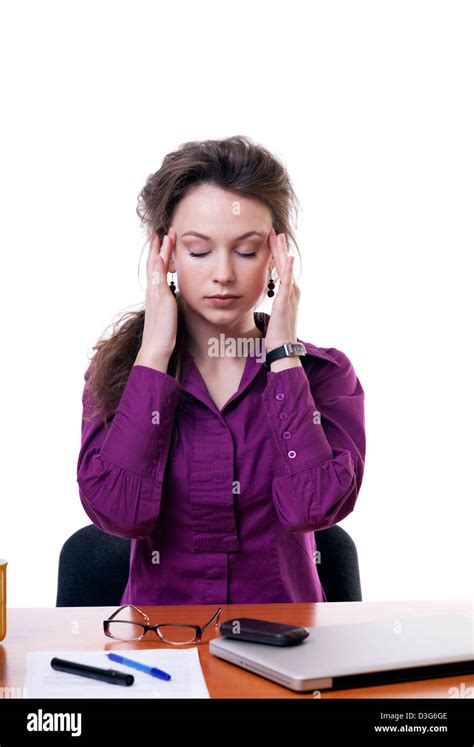 Businesswoman at an office table having a headache isolated on white ...