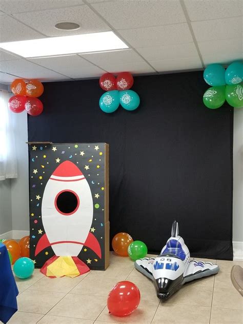 Rocket Photo booth and inflatable space ship. Birthday decoration outer space theme party Space ...