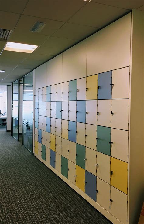 Built in locker wall for personal storage within a large corporate office. Courtesy of Aztec ...