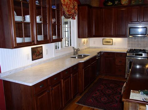 Kitchens with cherry cabinets and white countertops | City Of