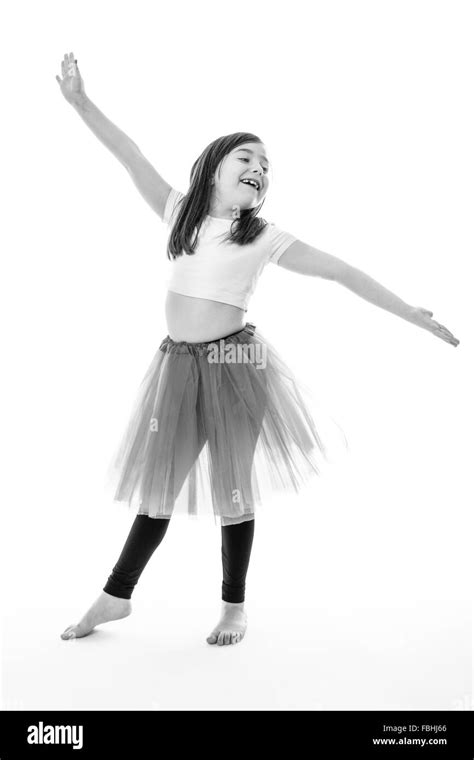 Pretty young girl posing in a bright pink tutu Stock Photo - Alamy