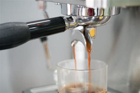 Coffee Extraction from Coffee Machine in Cup Stock Photo - Image of ...