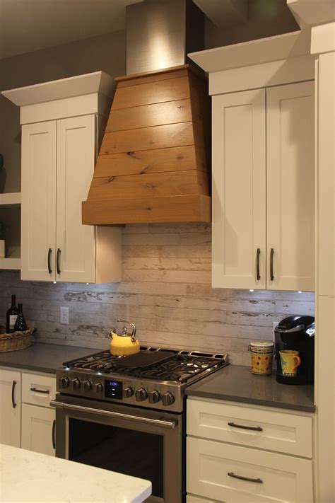 Wood Covered Vent Hood – Wood Look Ceramic Tile Backsplash - Degraaf Interiors | Wood backsplash ...