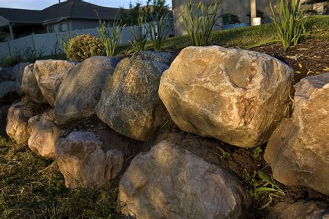 boulder Retaining Wall...hmmm..maybe with some shrubs in between to stop the water… | Boulder ...