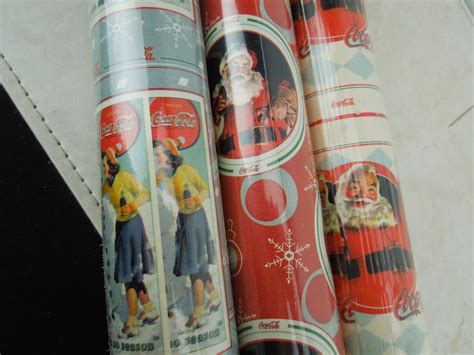 Lot - Coca Cola Three Unopened Christmas Wrapping Paper Rolls