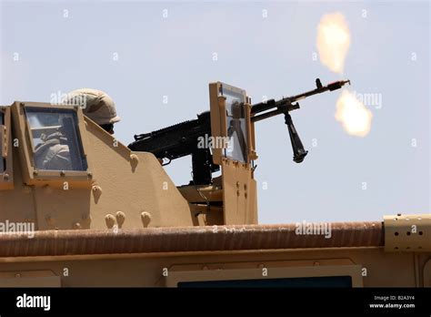 Military Humvee mounted machine gun firing blank rounds during Stock Photo, Royalty Free Image ...