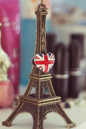 a miniature eiffel tower with the british flag on it
