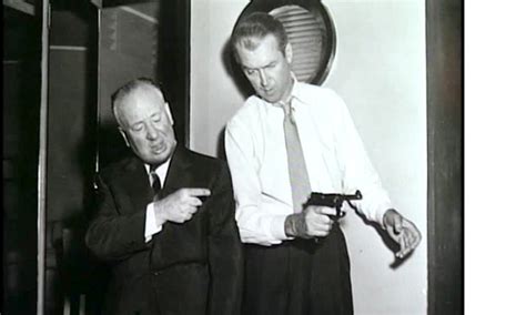 Alfred Hitchcock shows James Stewart how --- in, ''The Man… | Flickr