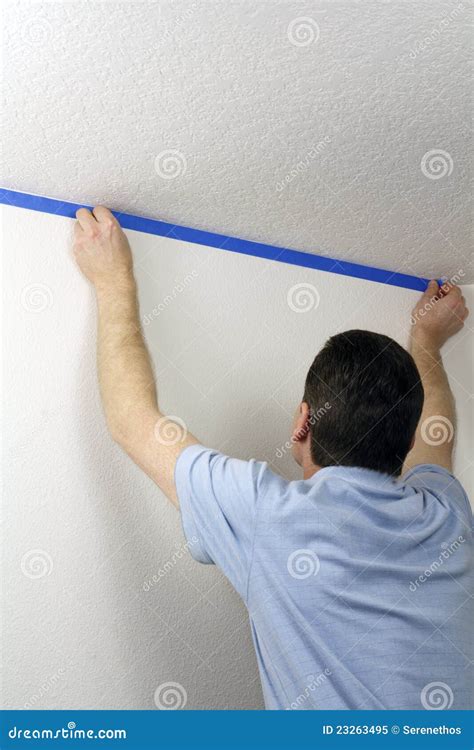 Masking a Wall with Blue Tape Stock Image - Image of improvements ...