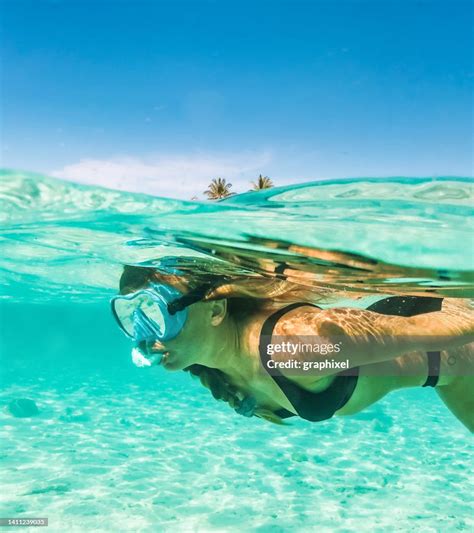 Woman Snorkeling In The Maldives High-Res Stock Photo - Getty Images