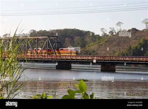 Panama Canal Railway train crosses the Gamboa Bridge, Gamboa, Panama ...