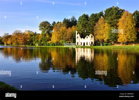 Autumn View of Painshill Park, with the Ruined Abbey and Reflections in the Lake Stock Photo - Alamy