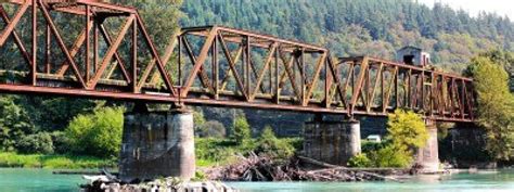 The now abandoned warren through truss swing span bridge over the Skagit River in Skagit County ...