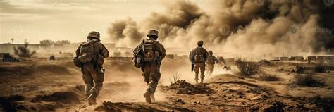 Military special forces soldiers crosses destroyed warzone through fire and smoke in the desert ...