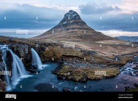 Long exposure at the Snæfellsnes Peninsula landmark view of Snæfellsjökull Volcano. Golden ...