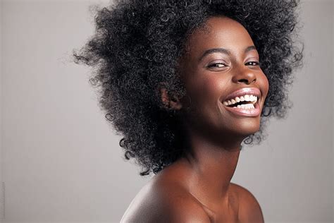 "Smiling African Woman" by Stocksy Contributor "Lumina" - Stocksy