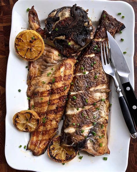 Grilled whole catfish, courtesy of @julesfood, because it's summer and you can grill anything. # ...