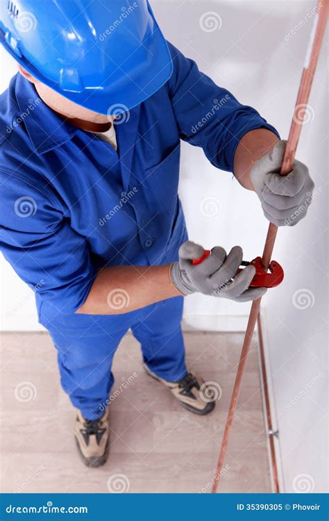 Tradesman using a tool stock image. Image of long, nimble - 35390305