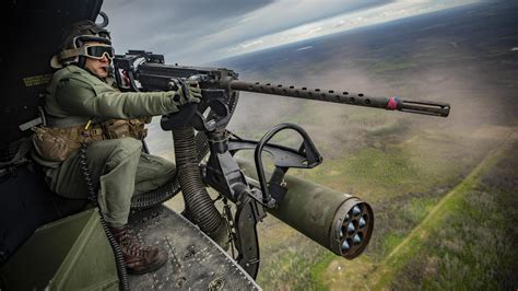 USMC Sgt. Darrin Smith, operates a GAU-21/A during a live-fire event at ...