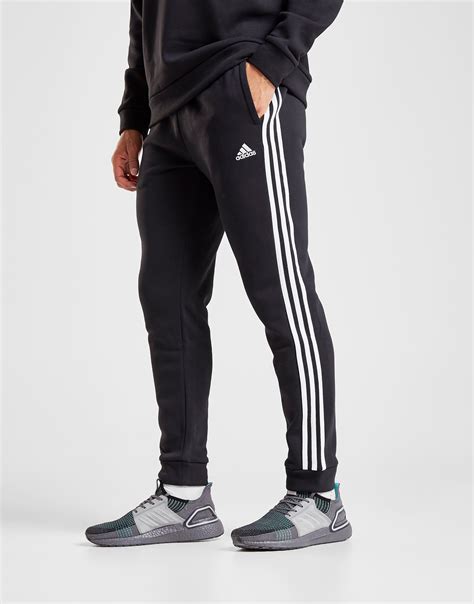 Buy Black adidas Essentials 3-Stripes Track Pants | JD Sports | JD Sports Ireland