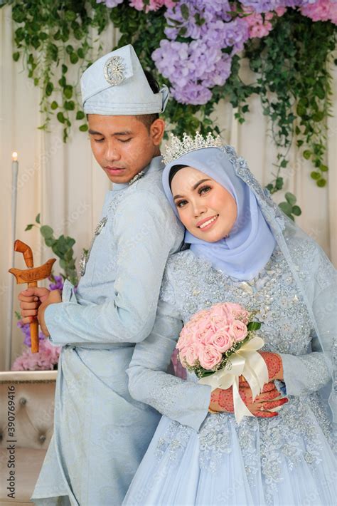 Indoor shooting for Malay wedding, the bride and groom wearing Malay traditional cloth in ...