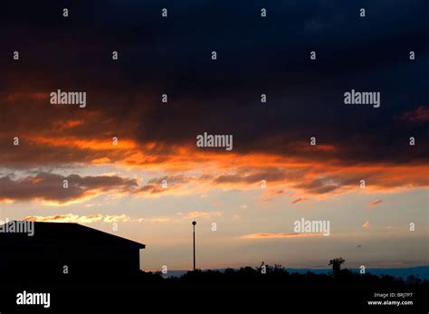 Dramatic clouds at sunset Stock Photo - Alamy