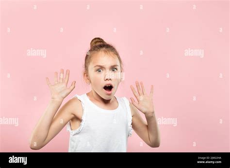 surprised shocked cute girl gasping emotional face Stock Photo - Alamy