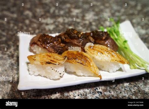 Engawa (Flounder fin) and Wagyu beef sushi Stock Photo - Alamy